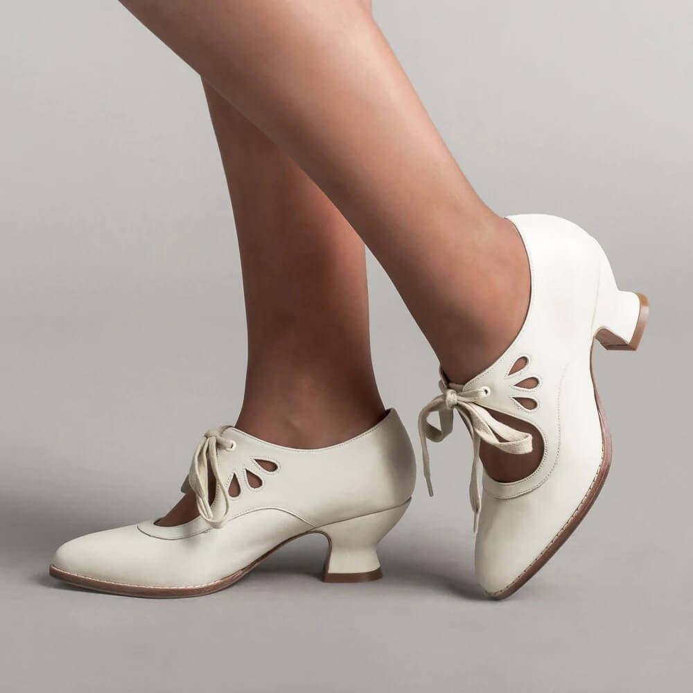 Vintage pin-up stiletto heels with ankle strap, retro silhouette in classic feminine style