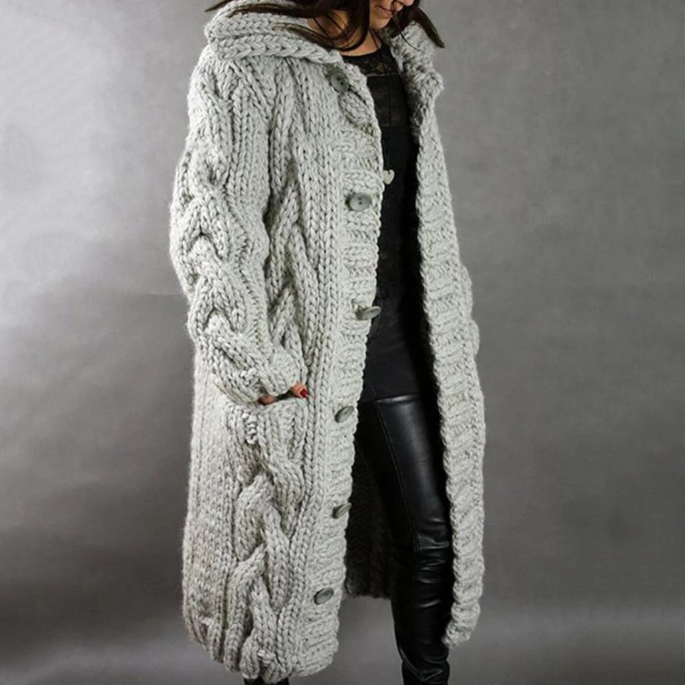 Women's long cable knit cardigan in cozy chunky texture, full-length silhouette for winter layering