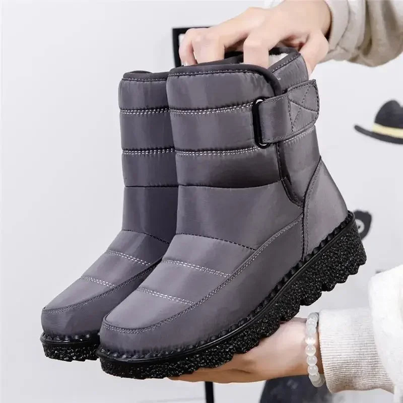 Women's black waterproof ankle boots sleek streamlined silhouette with polished smooth leather finish