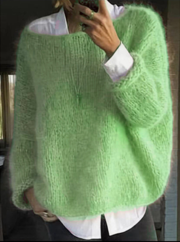 Lightweight knitted sweater in soft neutral tone, slim-fit layering style with cozy texture
