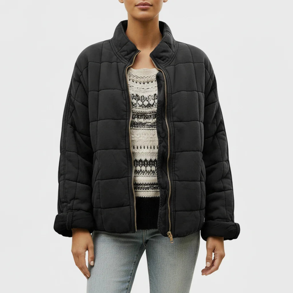 Women's black quilted bomber jacket with stand collar and loose fit for transitional weather