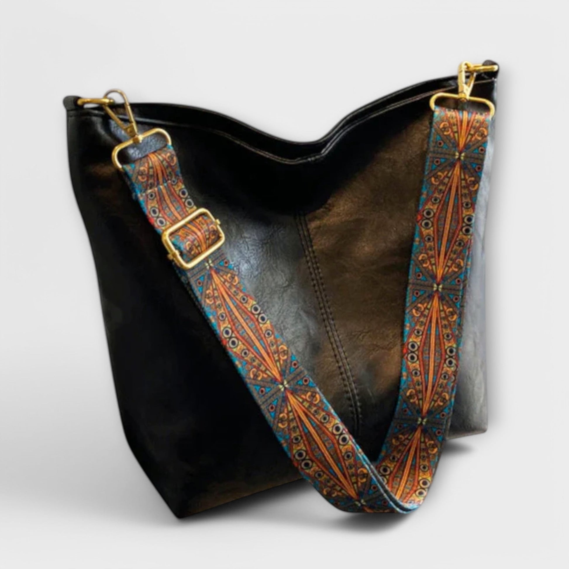 Ingebjorg shoulder bag with wide patterned strap, classic silhouette and modern artistic detail