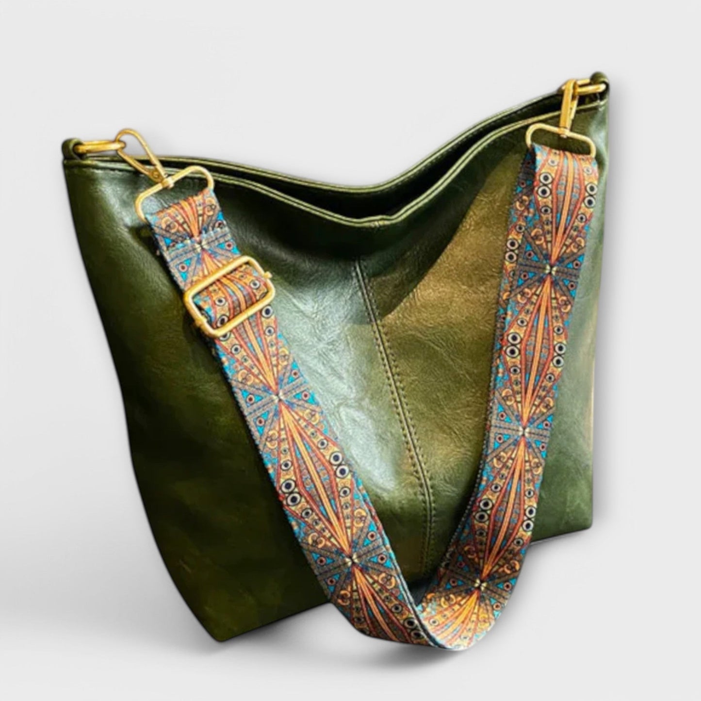 Ingebjorg shoulder bag with wide patterned strap, classic silhouette and modern artistic detail