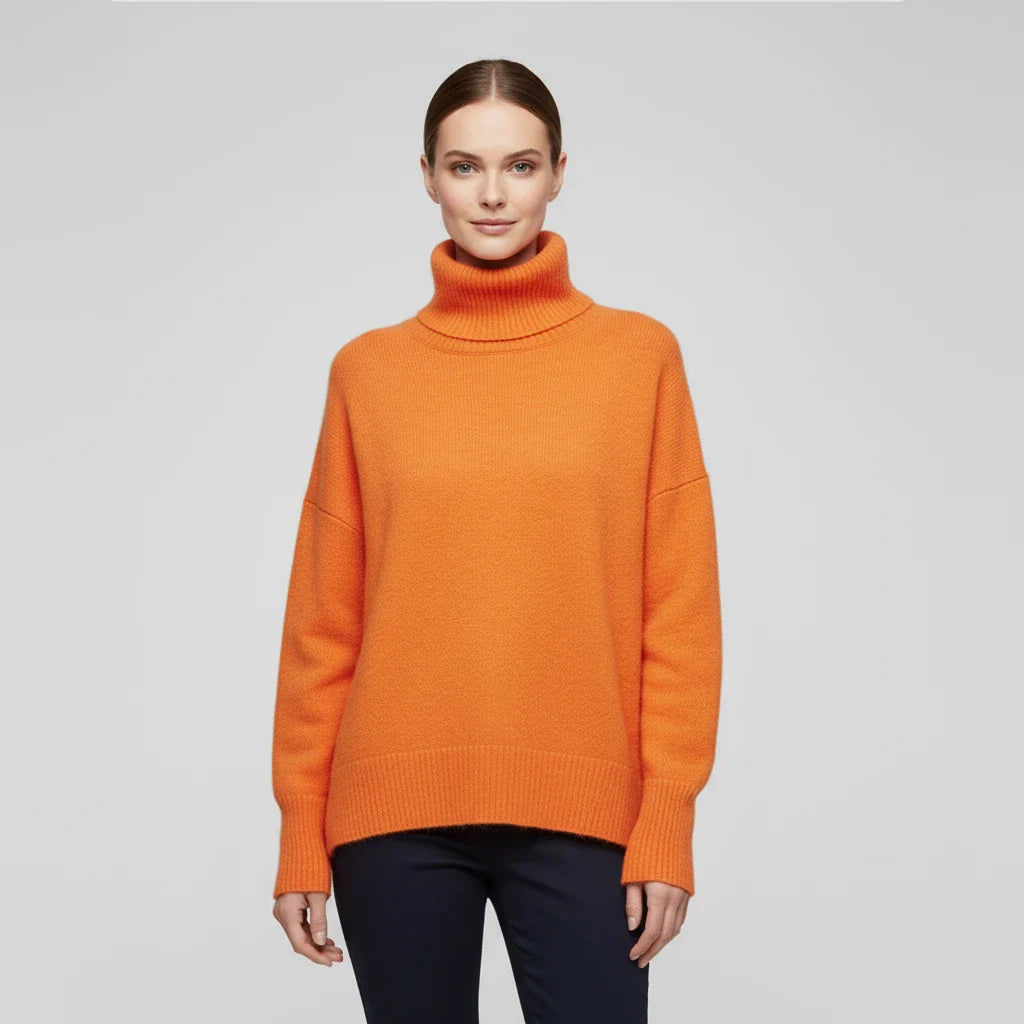 Women's oversized turtleneck knit sweater with drop shoulders and ribbed texture for cozy casual style