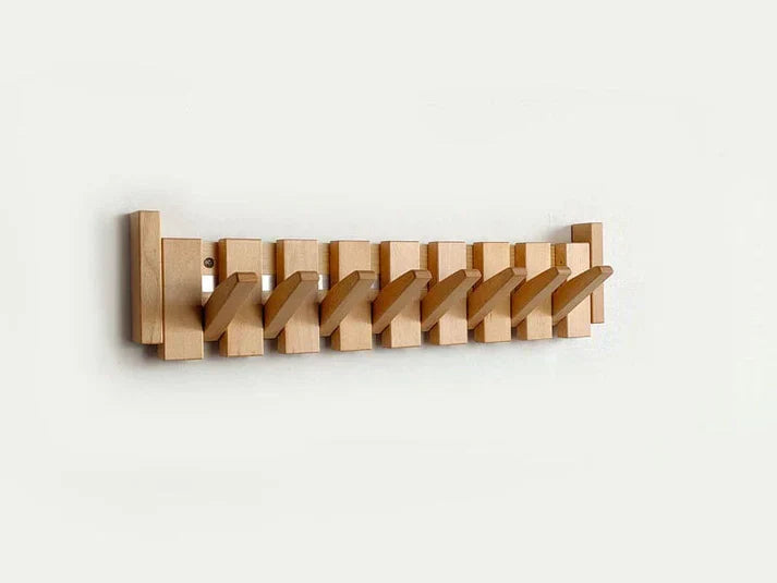 Minimalist wooden wall-mounted coat rack with natural grain finish and clean lines for modern interiors
