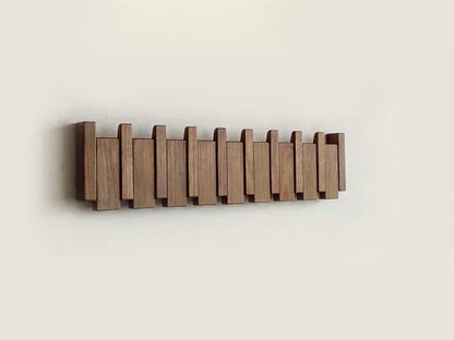 Minimalist wooden wall-mounted coat rack with natural grain, warm tone, and clean modern lines