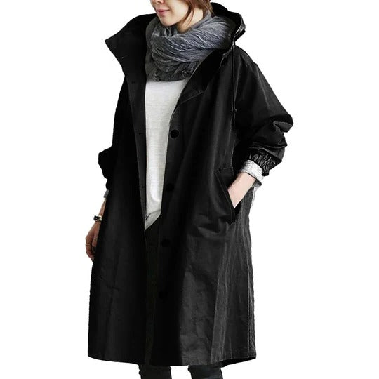 Women's long water-resistant raincoat with full coverage, adjustable hood, and straight silhouette