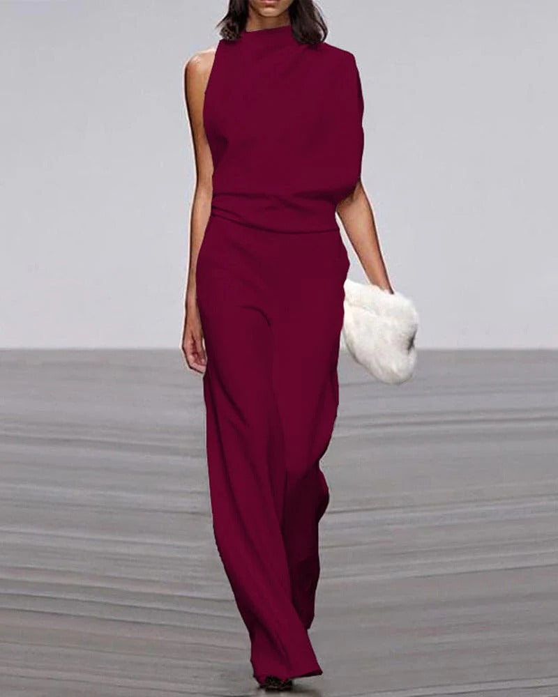 Ivory sleeveless wide leg jumpsuit with mock neck and asymmetric draped shoulder formal style