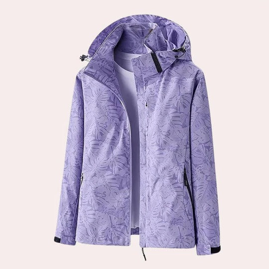 Women's camouflage hooded jacket with detachable hood, functional pockets, and breathable fabric