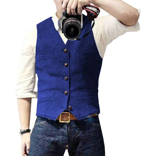 Men's blue denim vest with button closure, slim casual cut, and multiple practical pockets