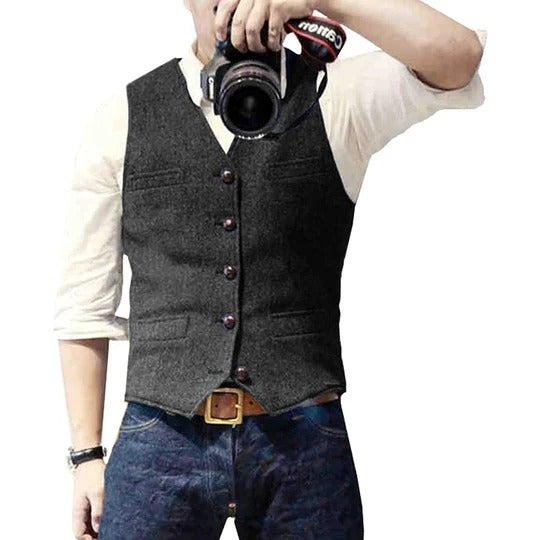 Men's blue denim vest with button closure, slim casual cut, and multiple practical pockets