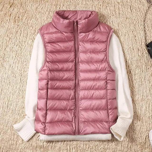 Women's slim lightweight sleeveless puffer vest for cold weather layering, insulated zip-front design