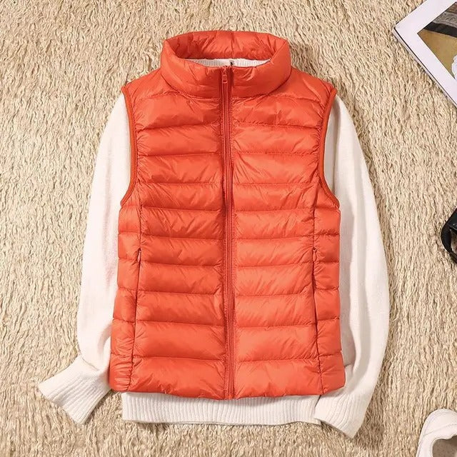 Women's slim lightweight sleeveless puffer vest for cold weather layering, insulated quilted design