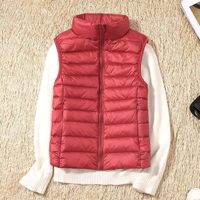 Women's slim lightweight sleeveless puffer vest for cold weather layering, insulated zip-front design