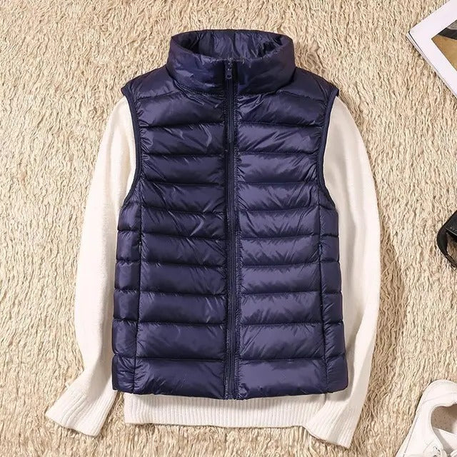 Women's lightweight sleeveless puffer vest, slim fit insulated design for cold weather layering