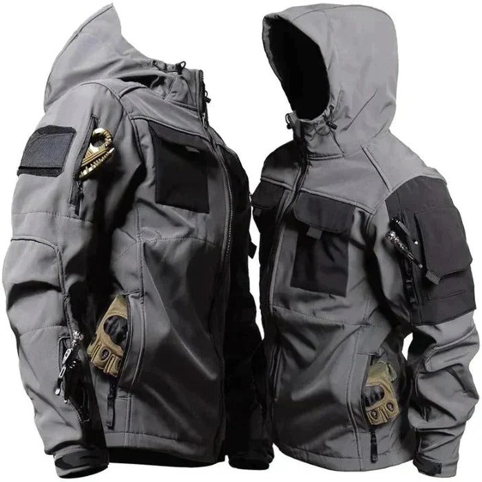 Olive green wind-resistant outdoor jacket with high collar, multi-pocket design, and structured silhouette