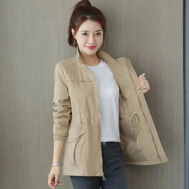 Lightweight beige trench coat streamlined cut adjustable waist raised collar daily wear