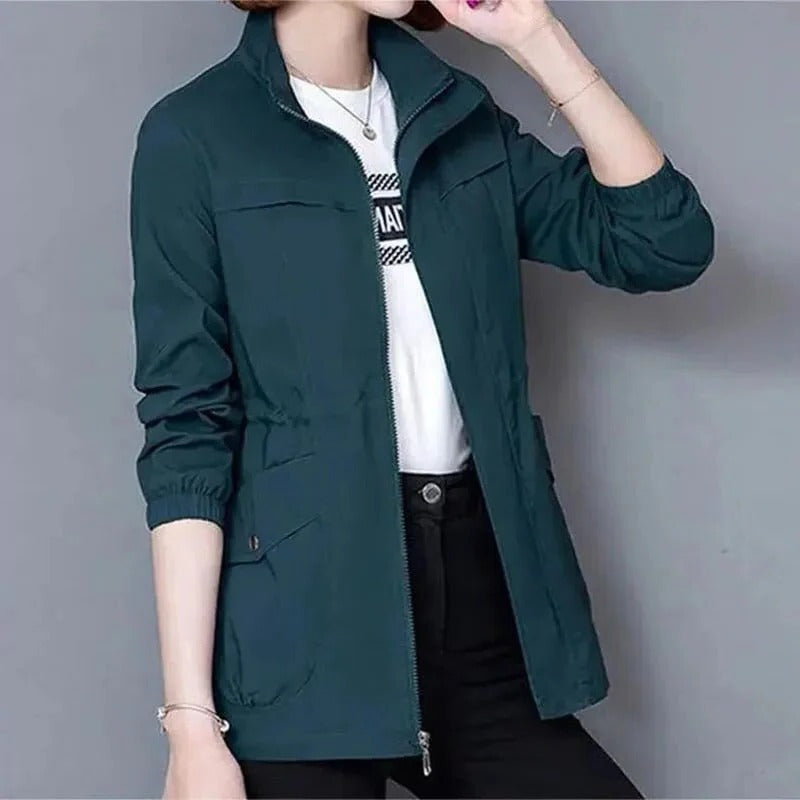Lightweight beige trench coat streamlined cut adjustable waist raised collar daily wear