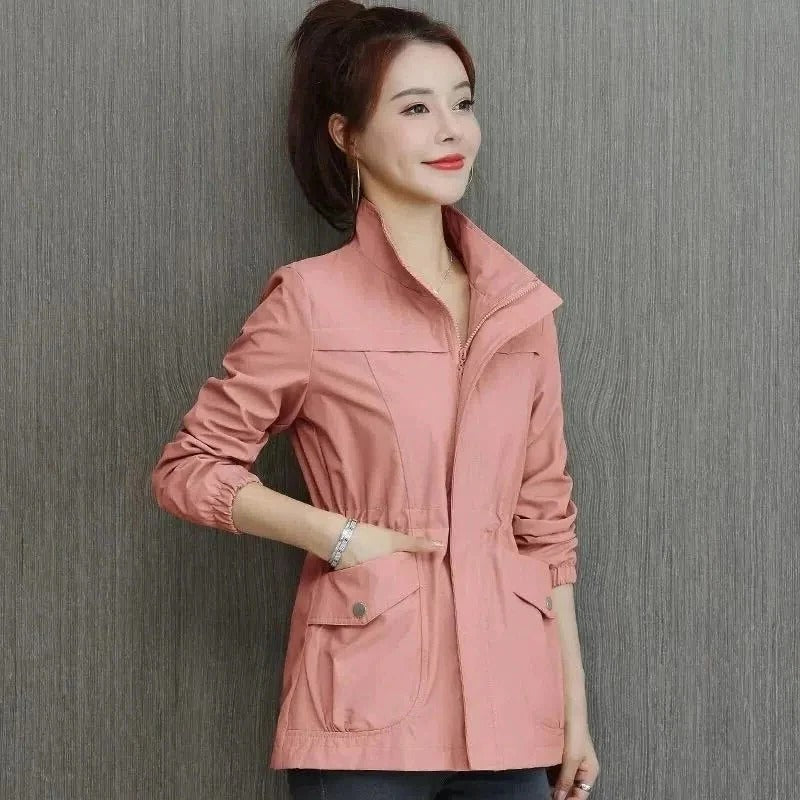 Lightweight beige trench coat streamlined cut adjustable waist raised collar daily wear