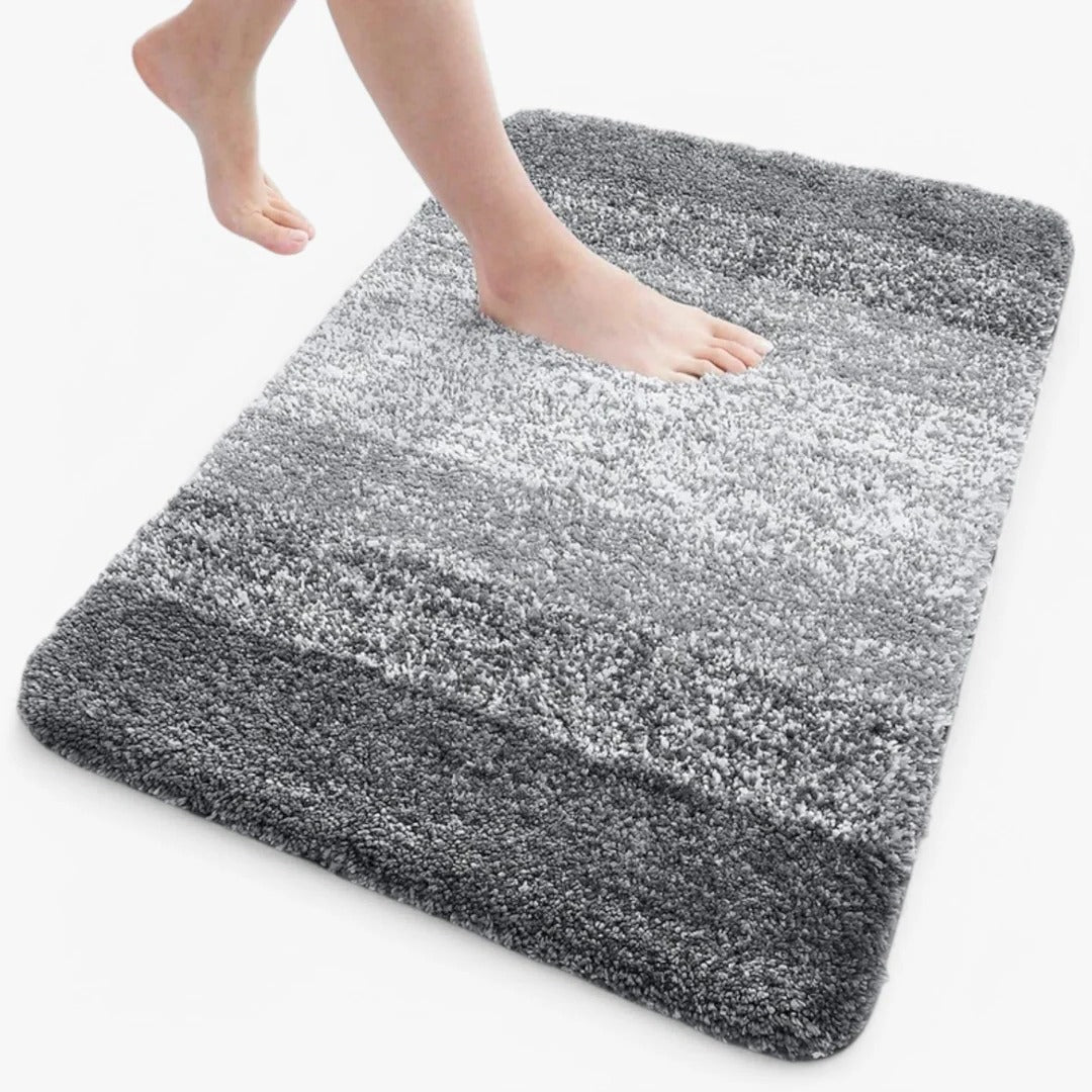 Slip-resistant quick-dry bathroom mat with absorbent surface texture for shower and bath areas