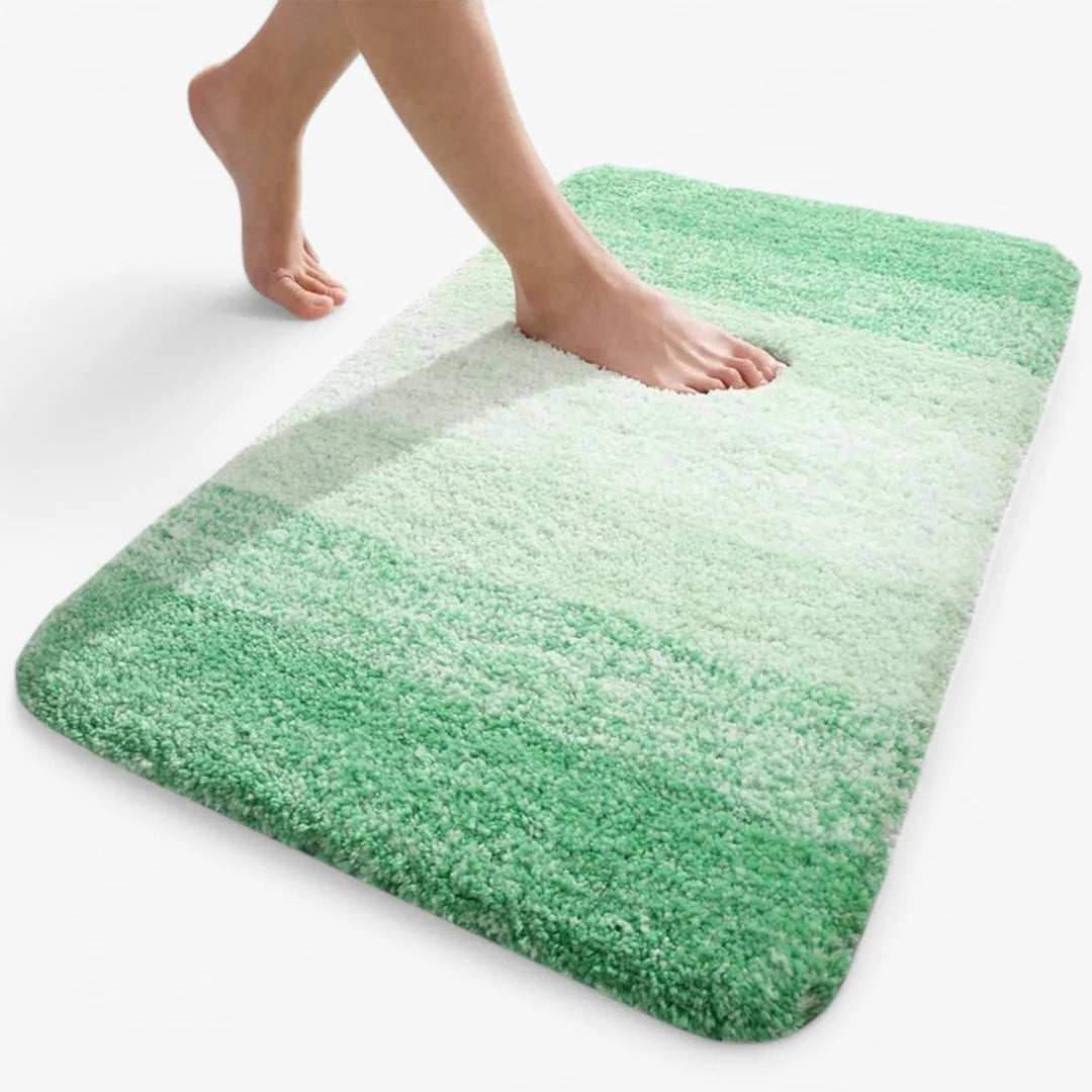 Slip-resistant quick-drying bathroom mat with absorbent surface for shower and entryway use