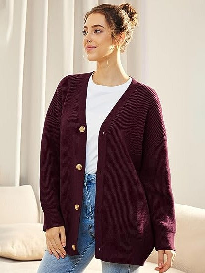 Women's oversized V-neck cardigan with button closure, dropped shoulders, cozy layering essential