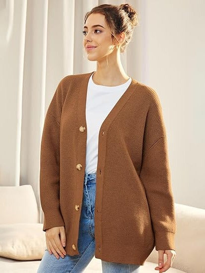 Women's oversized v-neck cardigan with button closure, cozy dropped-shoulder layering style
