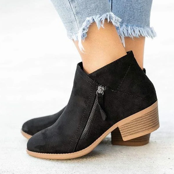 Black orthopedic heel boots with triple-arch support, structured design for everyday comfort and stability