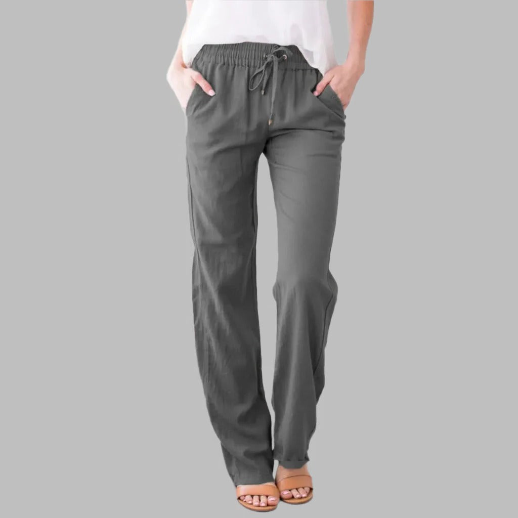 Relaxed fit women's trousers in neutral tone, loose silhouette for all-day comfort and natural movement