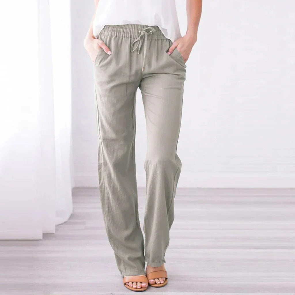 Relaxed fit women's trousers in neutral tone, wide-leg silhouette with soft lightweight fabric