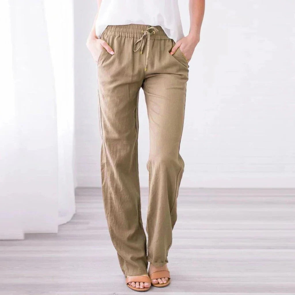 Relaxed fit women's trousers in neutral tone, wide-leg silhouette with soft lightweight fabric for everyday wear
