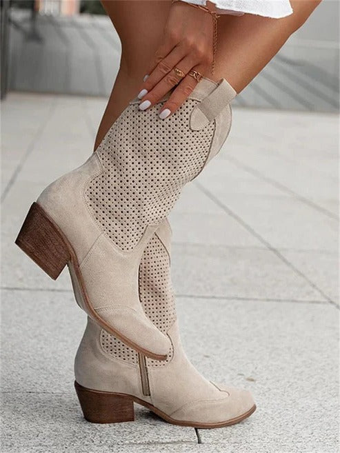 Women's western cowboy boots in tan leather with perforated detailing and classic block heel