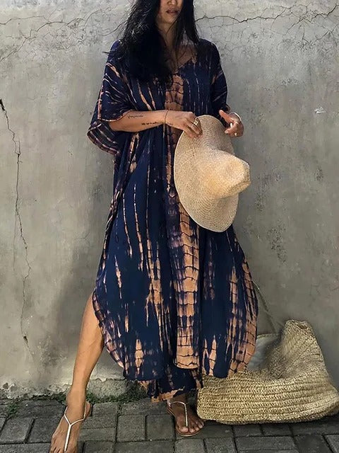 Women's kaftan maxi dress in vibrant print, relaxed plus-size silhouette with airy drape for summer