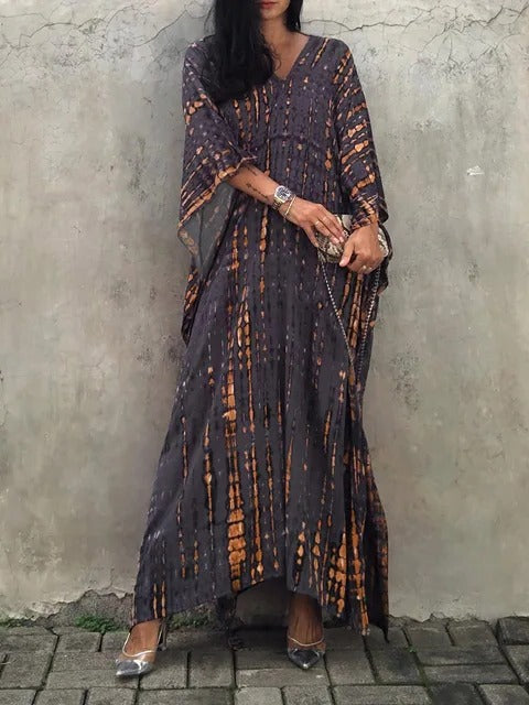 Women's kaftan maxi dress in vibrant print, relaxed silhouette with airy drape, plus-size summer style