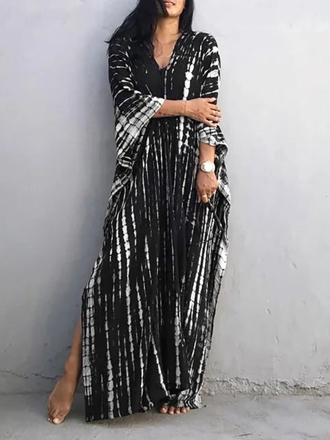 Women's kaftan maxi dress in vibrant print, relaxed plus-size silhouette with airy drape for summer