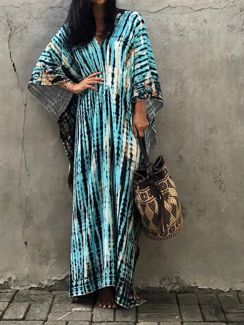 Women's kaftan maxi dress in vibrant print, relaxed plus-size silhouette with airy drape for summer