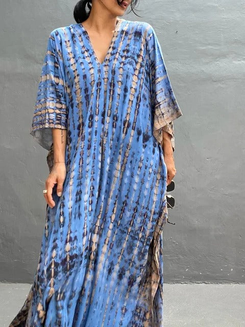 Women's kaftan maxi dress in vibrant print, relaxed plus-size silhouette with airy drape for summer