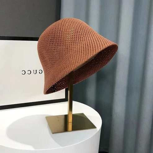 Women's wide brim straw sun hat in neutral beige, lightweight breathable design with UPF beach style