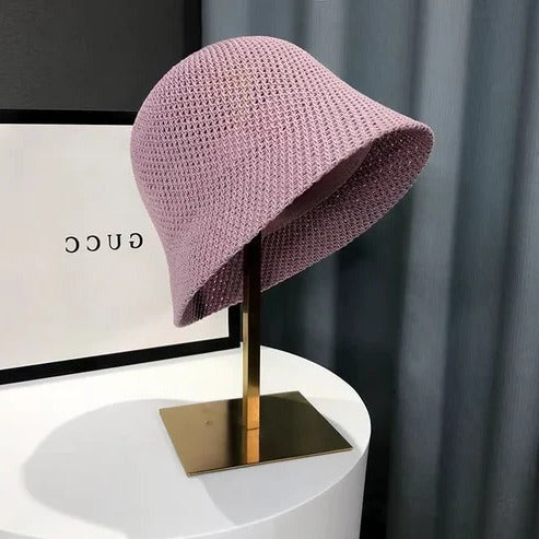 Women's wide brim summer sun hat in neutral tone, lightweight breathable design for beach and travel