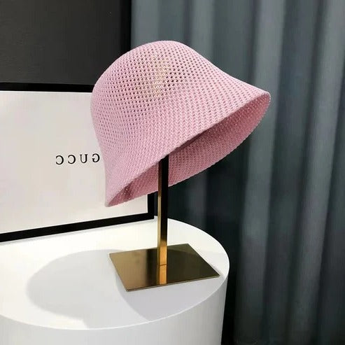 Women's wide brim summer sun hat in neutral tone, lightweight breathable design for beach and travel