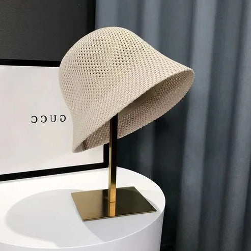 Women's wide brim summer sun hat in neutral tone, lightweight breathable design for beach and travel