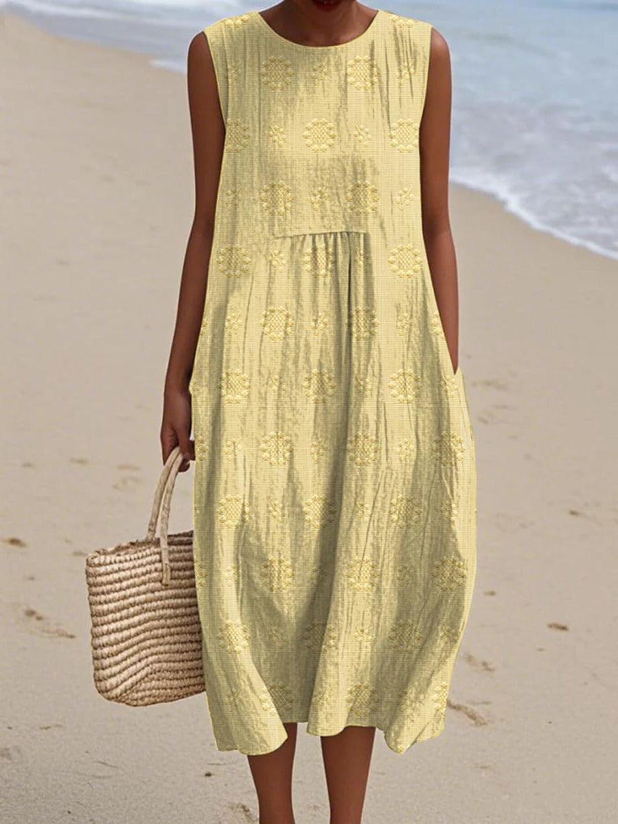 Women's sleeveless midi dress with gathered waist and subtle circular embroidery for effortless style