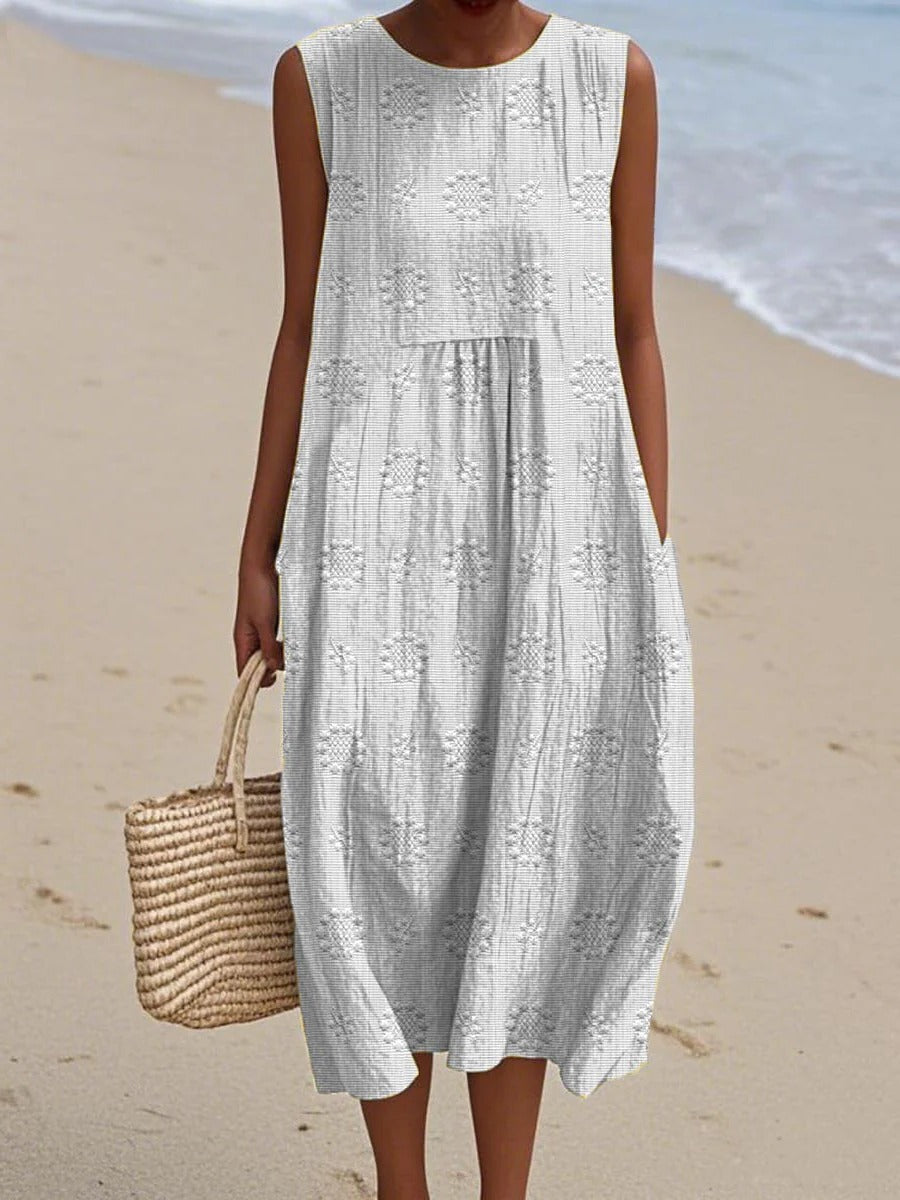 Women's sleeveless midi dress with gathered waist and subtle circular embroidery for effortless style