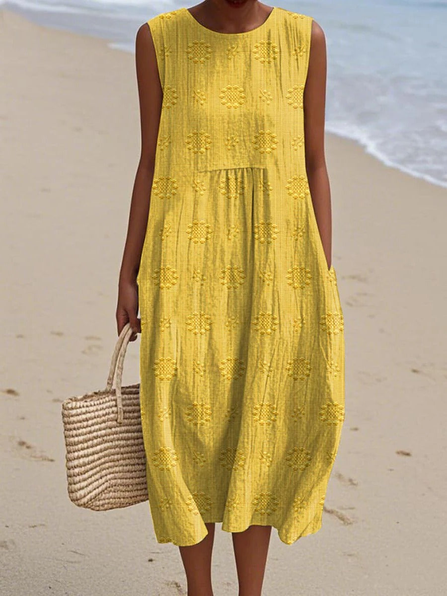 Women's sleeveless midi dress with gathered waist and subtle circular embroidery for effortless style