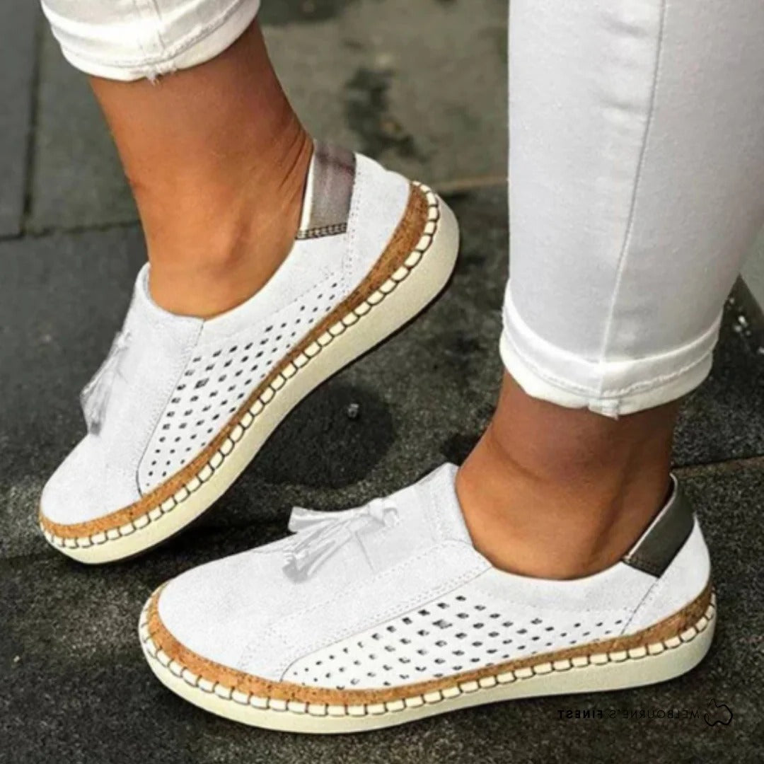 Women's casual slip-on shoes in neutral tone, lightweight breathable perforated upper, streamlined silhouette