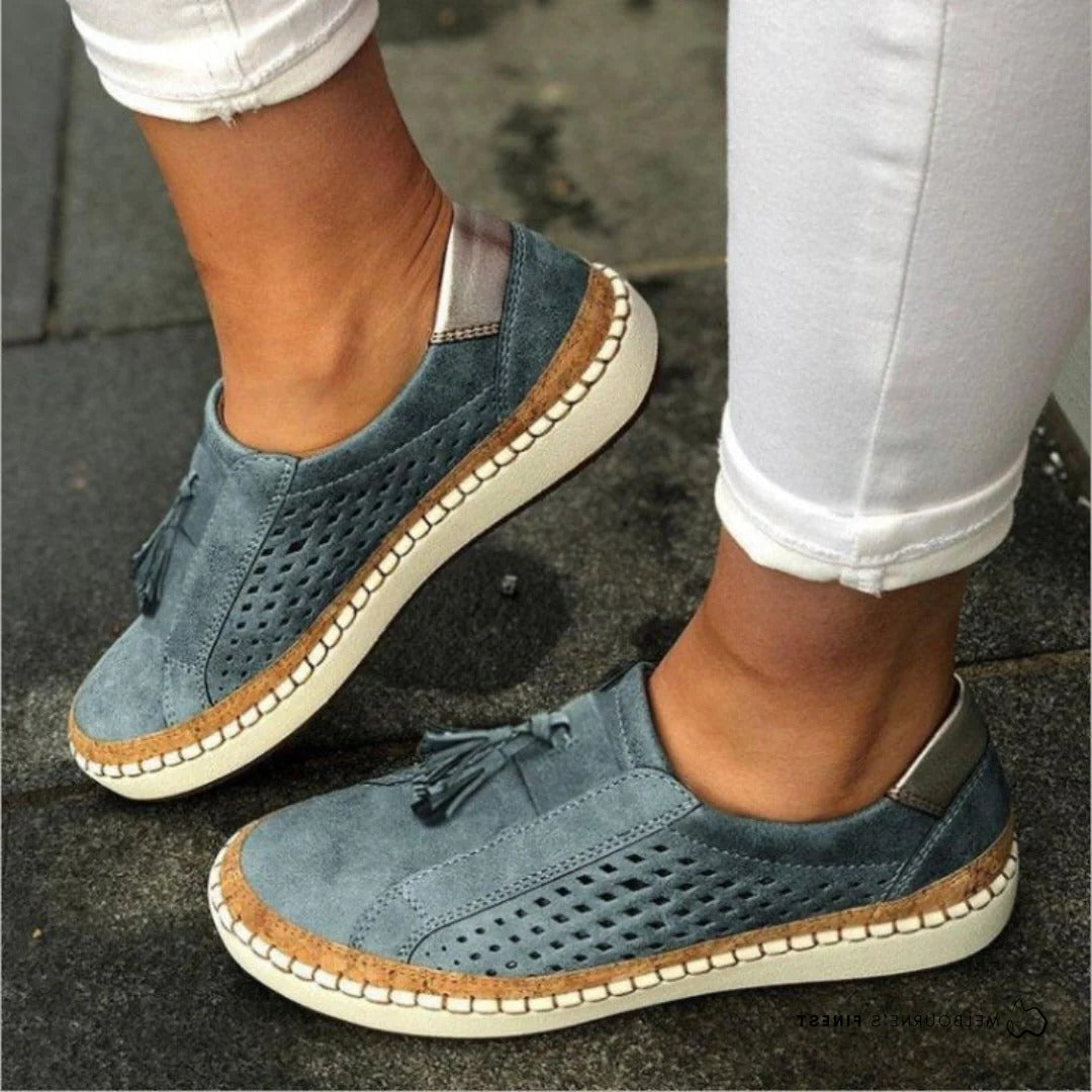 Women's casual slip-on shoes in neutral tone, lightweight breathable perforated upper, streamlined silhouette