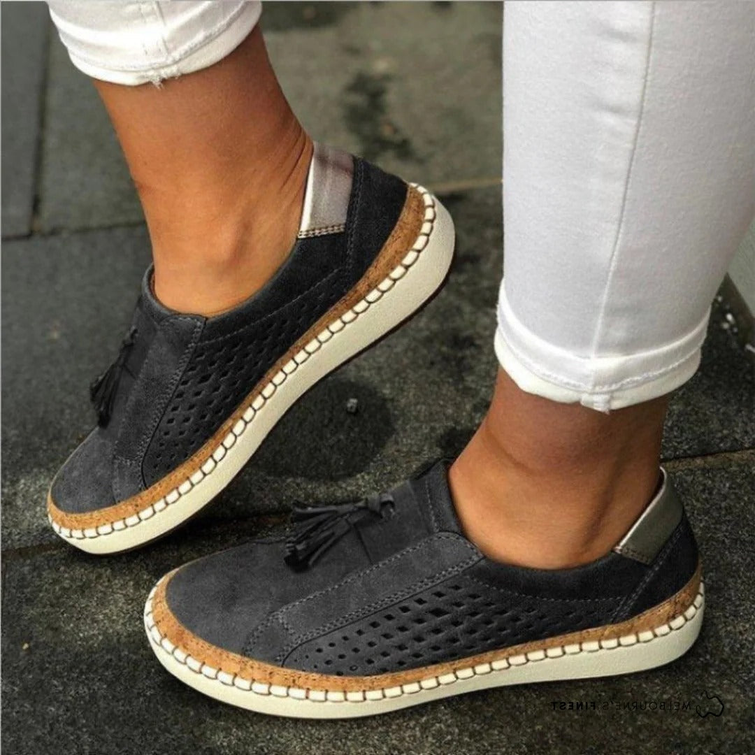 Women's casual slip-on shoes in neutral tone, lightweight breathable perforated upper, streamlined silhouette
