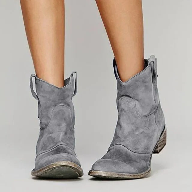 Women's western ankle boots in classic tan, pull-on cowboy silhouette with low block heel