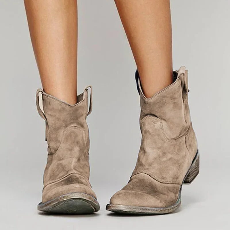 Women's western ankle boots in classic tan, pull-on cowboy silhouette with low block heel