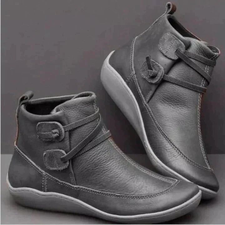Waterproof ankle boots in classic black, sleek low-heel design with water-resistant upper for all-weather wear